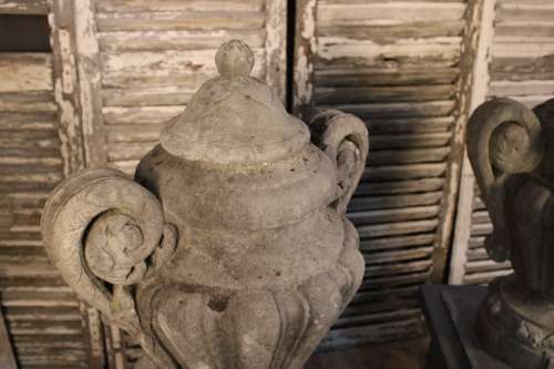 PAIR OF CARVED STONE LIDDED URNS
