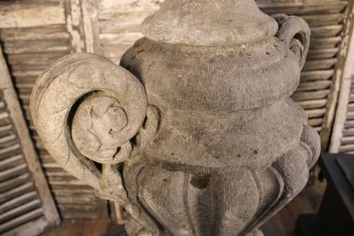 PAIR OF CARVED STONE LIDDED URNS