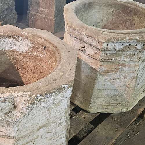 PAIR OF CARVED STONE WELL HEADS