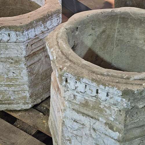 PAIR OF CARVED STONE WELL HEADS