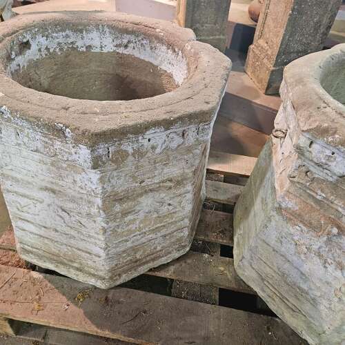 PAIR OF CARVED STONE WELL HEADS