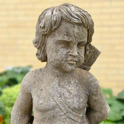 STATUE OF A YOUNG HUNTER WITH HIS DOG