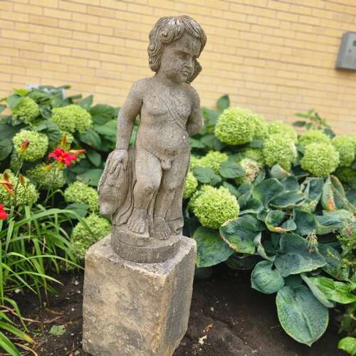 STATUE OF A YOUNG HUNTER WITH HIS DOG
