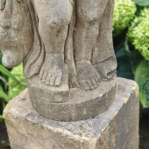 STATUE OF A YOUNG HUNTER WITH HIS DOG